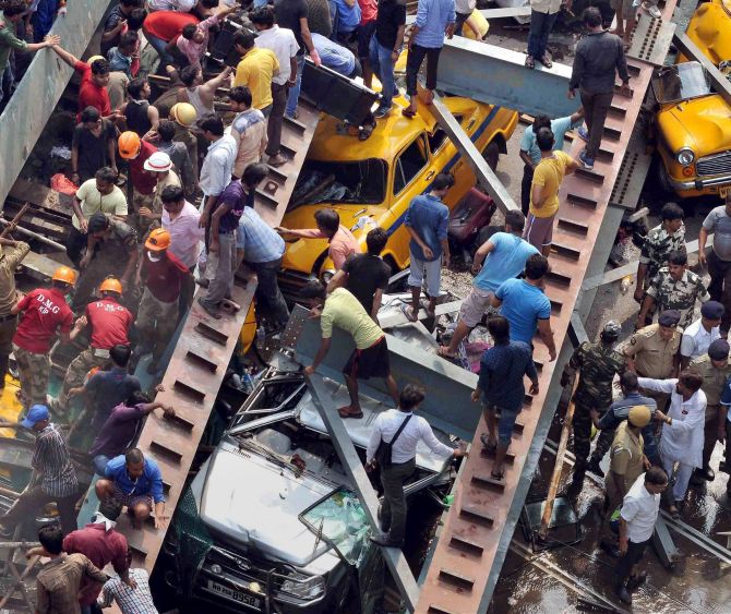Kolkata: Rescue operations going on after an under-construction flyover collapsed on Vivekananda Road in Kolkata on Thursday. PTI Photo(PTI3_31_2016_000242B)